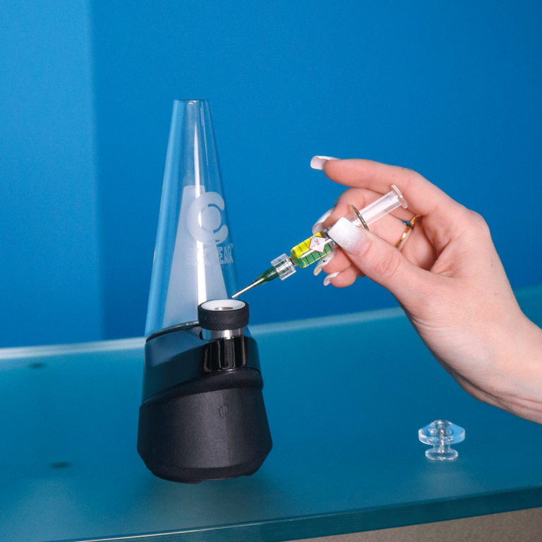 The Clear Elite syringe and Puffco Peak vaporizer