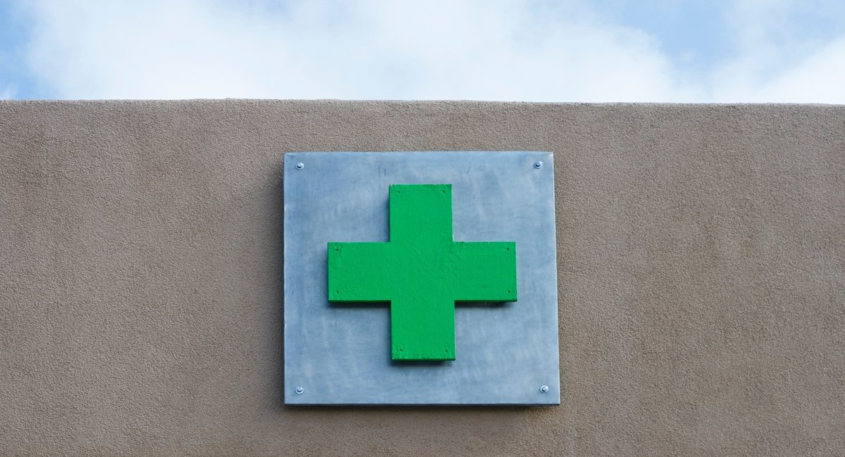 Green plus sign associated with medical marijuana dispensaries, cannabis doctors, and medical cards.