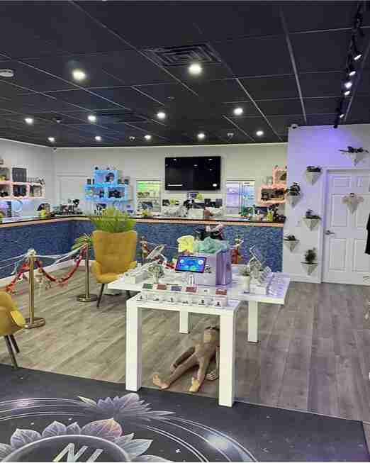Product displays and seating inside NJ Pure dispensary in Edgewater Park, NJ